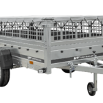 Einachsiger Anhänger auf Blattfedern 264×125 UNITRAILER GARDEN 264/R KIPP mit Gitterseitenwänden, H-0-Rahmen und grauer Plane